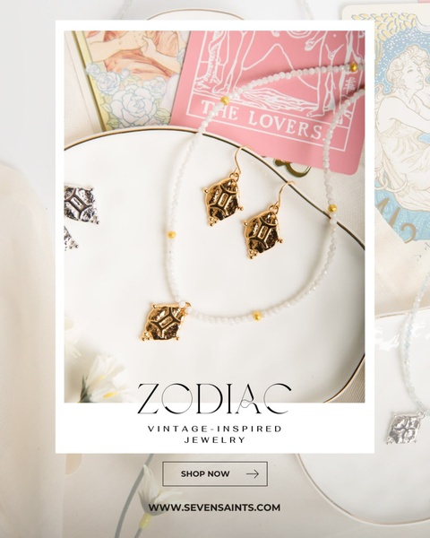 A high-end flat lay featuring gold zodiac jewelry, white crystals, and tarot cards on a clean, professional background.