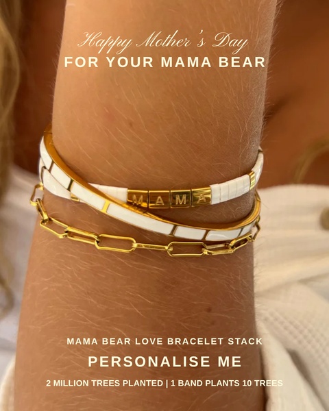 A close-up aesthetic shot of a personalized bracelet stack on a wrist, featuring gold-toned letters spelling out Mama, utilized for a Mother's Day seasonal campaign.