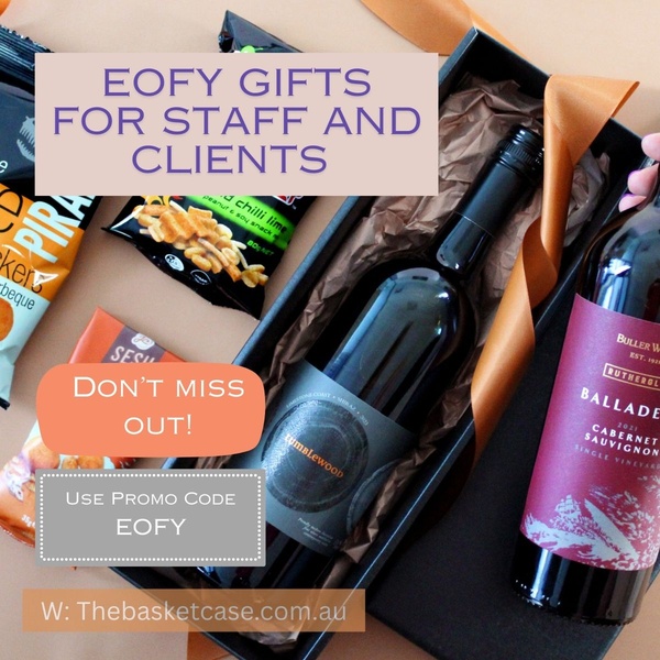 A square ad creative featuring a premium wine and snacks gift set, highlighting an end-of-financial-year promotion with a clear call to action.