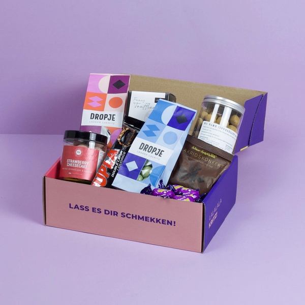 candy gift box, snack box, liquorice candy, gourmet sweets, gift basket, treat box, gift guide, brand awareness, minimalist, lifestyle, playful, fresh, purple, pink, neutral