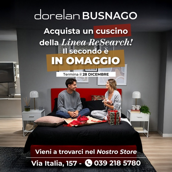A seasonal promotion creative featuring a couple on a bed, offering a buy-one-get-one-free deal on pillows to drive physical store traffic.