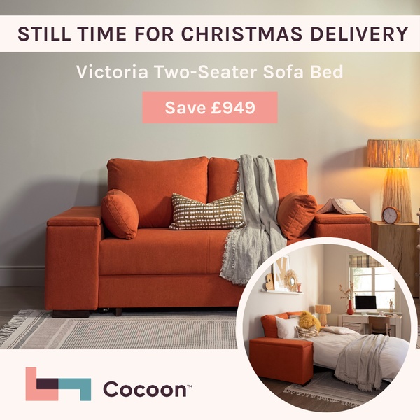 A square-format ad showcasing a sofa bed in a warm home environment with an overlay emphasizing Christmas delivery and price savings.