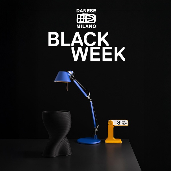 A high-contrast advertisement for a table lamp featuring bold text, stark black background, and clean composition to announce a seasonal sale.