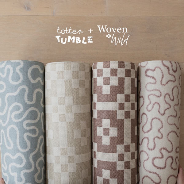 A top-down, clean aesthetic shot featuring four distinct Play Mat designs rolled up and lined up side-by-side to highlight the brand's aesthetic range.