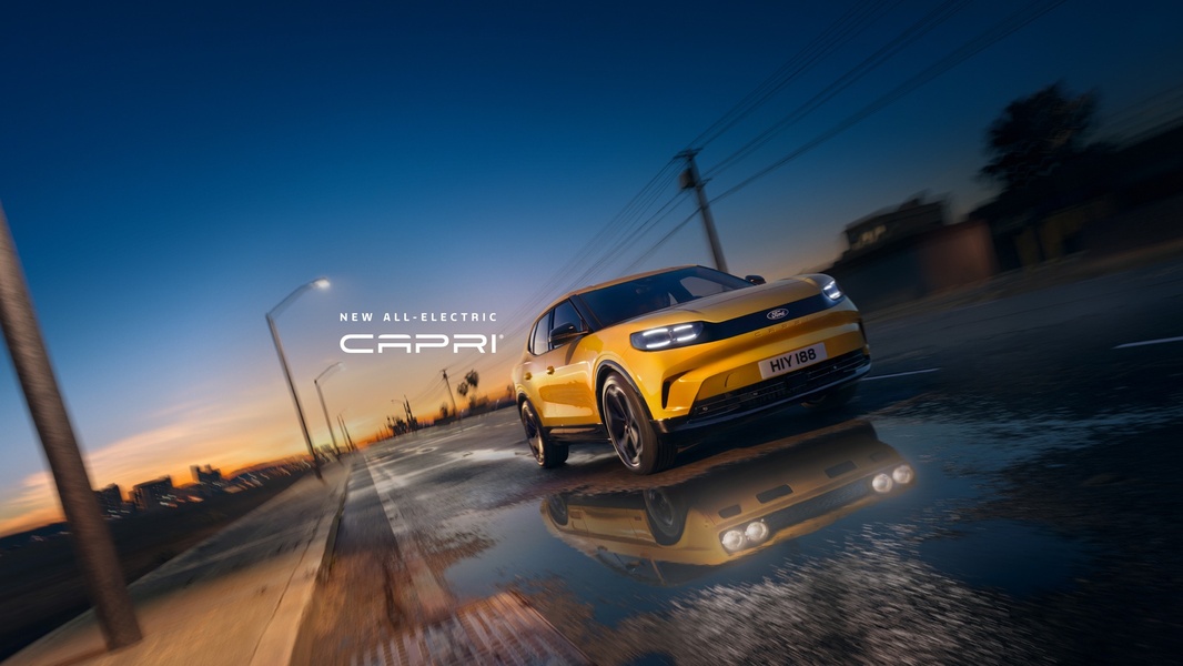 A high-speed shot of an all-electric SUV cruising through a city street at sunset, emphasizing motion blur and sleek automotive design.