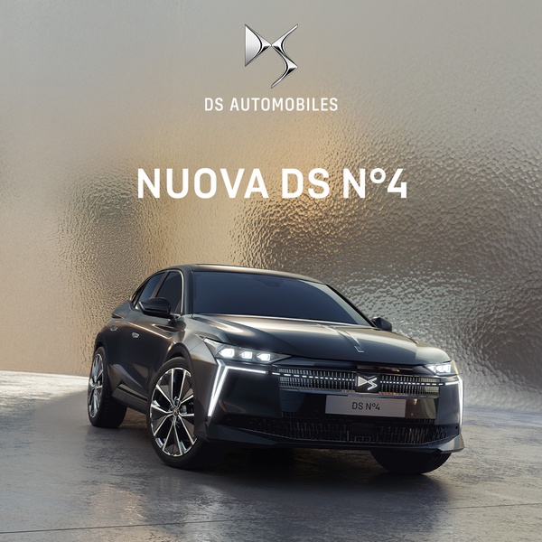 A high-end, studio-style hero shot of a luxury vehicle featuring refined lighting and a textured metallic background to emphasize brand prestige.