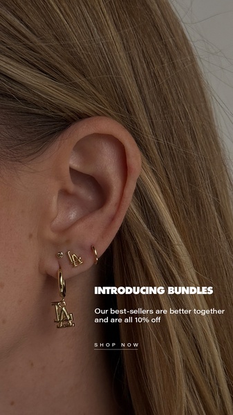 A clean, minimalist 9:16 vertical image focusing on a single ear styled with multiple earrings, highlighting a 10% discount on bundles.