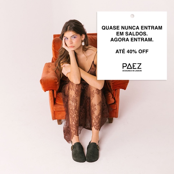 This 1:1 square creative features a model in a lace dress sitting in an orange chair, highlighting suede clogs with a bold sale headline.