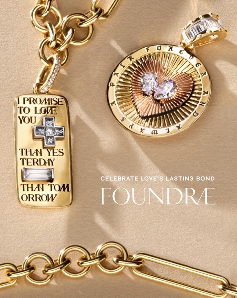 A close-up aesthetic shot of personalized jewelry pendants featuring sentimental messaging in gold and mixed-metal finishes.