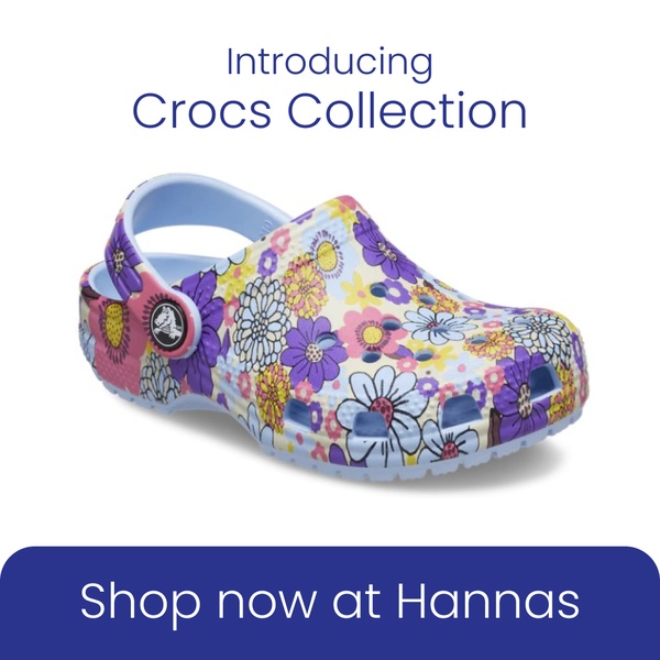 A clean, studio-lit product image of a floral-patterned clog on a white background, featuring direct text overlays.
