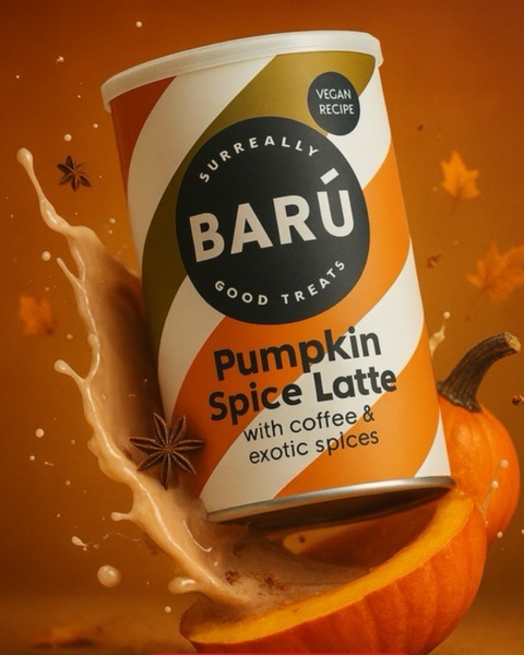A high-impact, vertical-format ad creative featuring a Pumpkin Spice Latte canister surrounded by fresh pumpkin components and dynamic liquid splashes.
