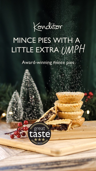 A festive mince pie hero shot featuring an award-winning seal and powdered sugar dusting. This creative uses high-contrast holiday imagery to stop the scroll.