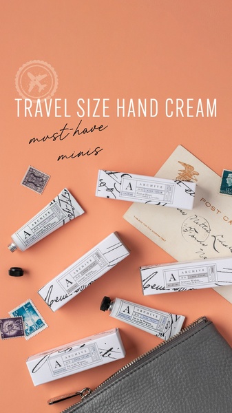 A top-down view showing multiple small hand cream tubes arranged on a warm peach background alongside old postcards, stamps, and a leather pouch to evoke a sense of travel.
