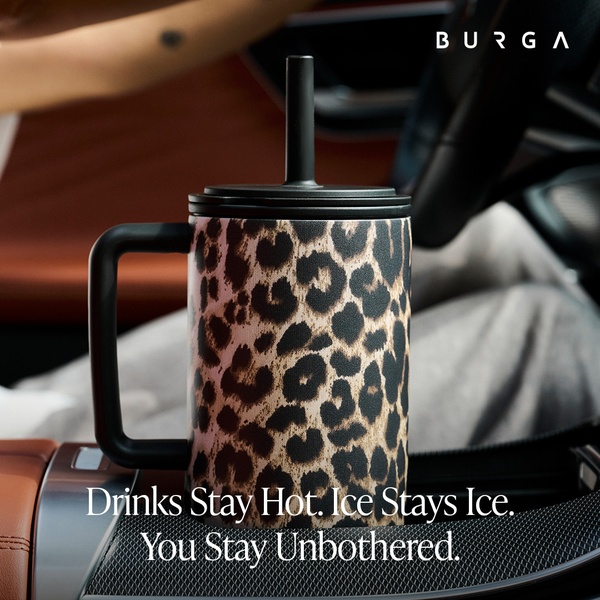 A high-quality 1:1 image featuring a leopard-print insulated travel mug placed in a car cupholder, signaling convenience and durability.