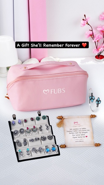 A high-quality product flat-lay featuring a curated jewelry box, various earrings, and a personalized scroll message against a clean pastel background.