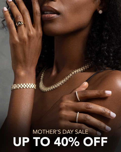 A refined, close-up lifestyle shot of gold jewelry worn by a model, featuring a clear seasonal discount call-to-action.