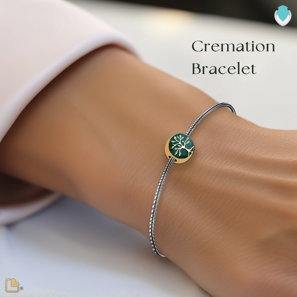 A close-up product shot of a tree-of-life themed cremation bracelet worn on a wrist, emphasizing clean, elegant design.