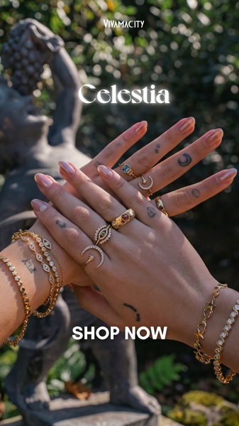 A close-up, high-aesthetic shot of hands adorned with multiple gold celestial-themed rings and delicate bracelets, set against a soft natural background.