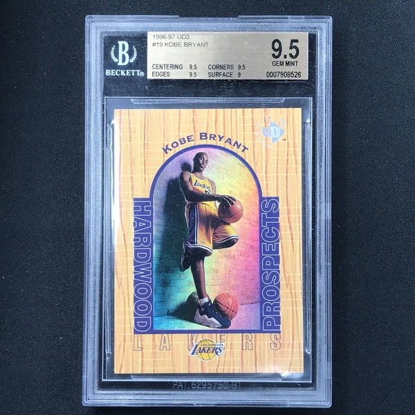 A high-quality, centered shot of a 1996-97 Kobe Bryant UD3 trading card in a protective Beckett-graded case against a dark background.