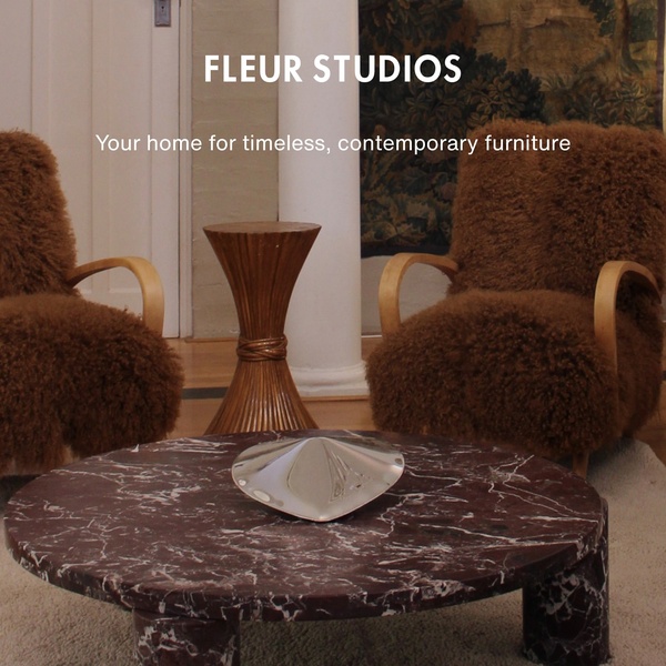 A sophisticated, high-end interior setting featuring textured furniture, a marble table, and clean, centered typography to evoke timeless elegance.