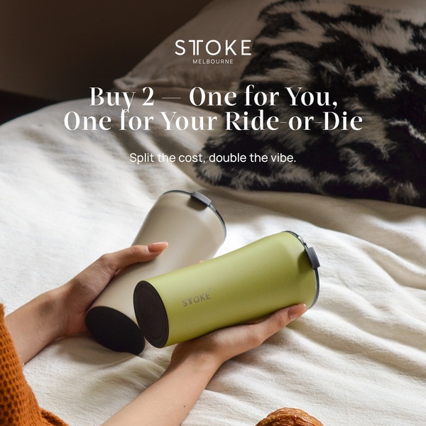 A lifestyle-focused image showing two hands holding different colored insulated tumblers, emphasizing a shared experience through a buy-two offer.
