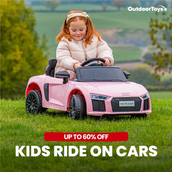 A bright outdoor shot of a child sitting in a pink ride-on car on a lush green lawn, overlaid with a prominent discount offer.