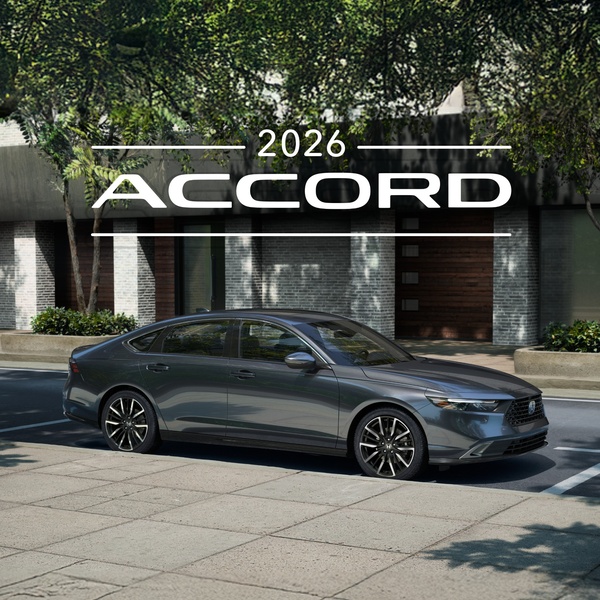 A high-end, clean side-profile shot of a dark metallic sedan parked on a city street, emphasizing luxury and modern design.