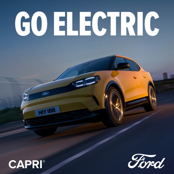 A high-performance electric crossover vehicle captured in motion against a sunset background with a bold call to action.