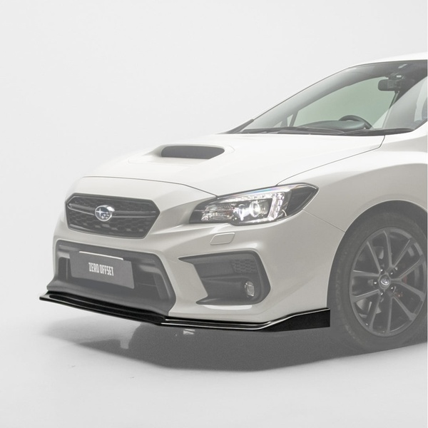 A high-end, clean studio product shot featuring a black front lip splitter installed on a white Subaru for a premium visual presentation.