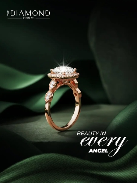 A high-end, close-up photograph of a diamond engagement ring displayed on rich green velvet, emphasizing craftsmanship and luxury.
