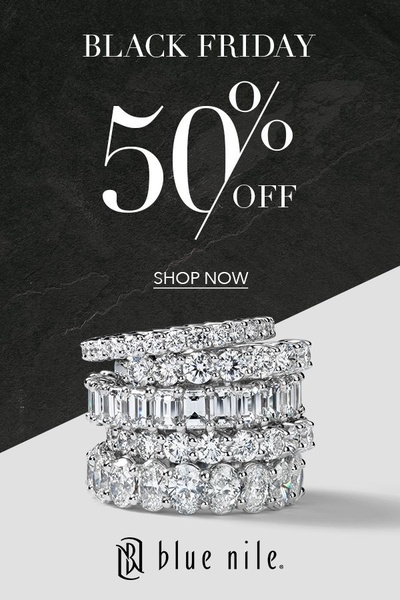 A high-contrast promotional graphic featuring a stack of five diamond rings on a split black and white background, highlighting a 50% off Black Friday offer.