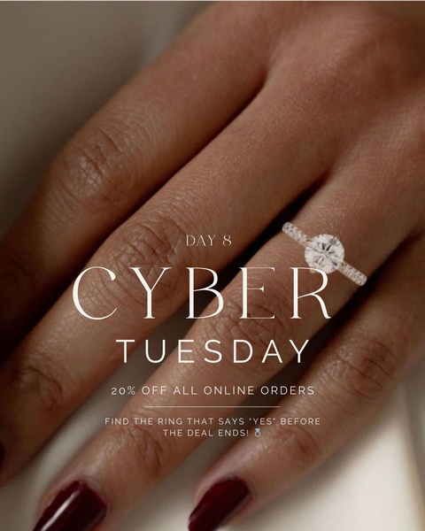 A close-up photograph of a hand wearing an elegant engagement ring, featuring a minimalist aesthetic and a direct discount offer for Cyber Tuesday.