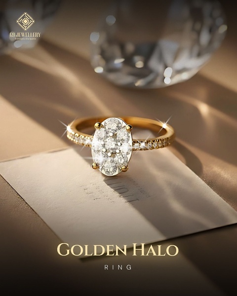 A high-end, close-up shot of a golden diamond halo ring resting on a textured card, bathed in warm, soft sunlight to emphasize sparkle and premium quality.