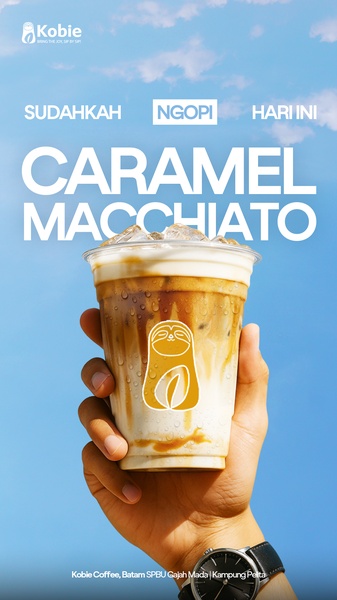 A vertical product shot featuring a hand holding a iced caramel macchiato against a clear blue sky, emphasizing brand identity and refreshment.