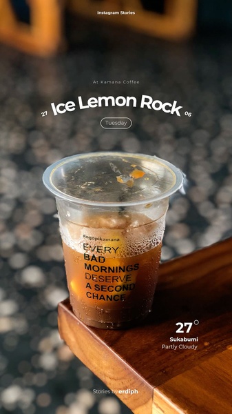 A high-contrast, moody aesthetic capture of an iced coffee cup featuring an inspirational quote, set against a blurred background.