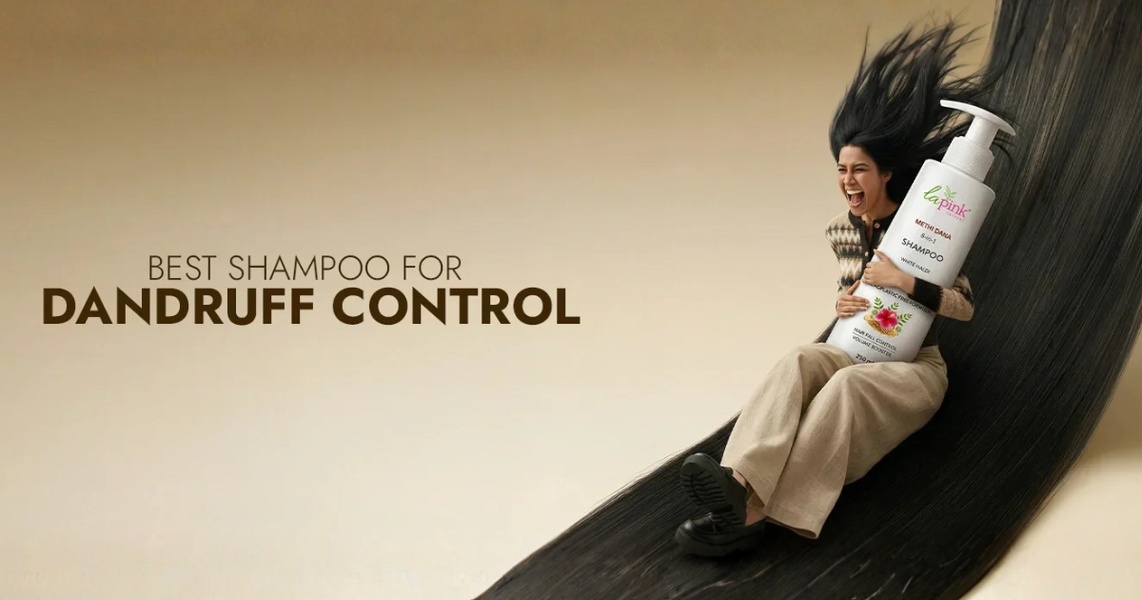A high-impact ad creative featuring a model sliding down a massive, stylized strand of hair while holding an oversized shampoo bottle.