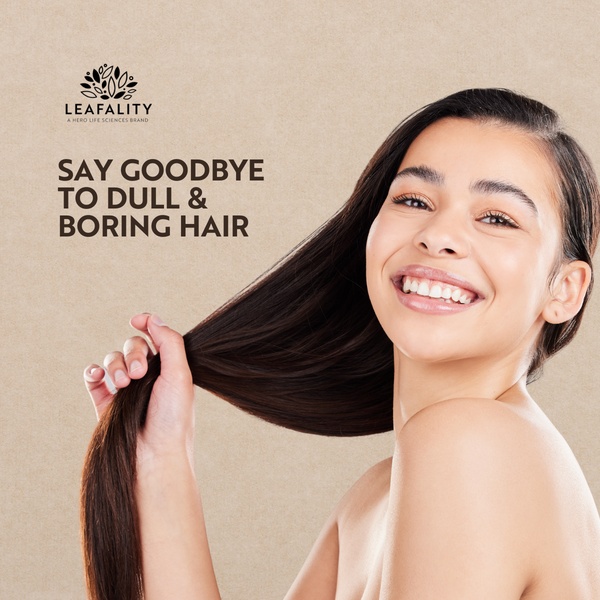 A clean, minimalist 1:1 square ad featuring a smiling model holding her hair to demonstrate product effectiveness.