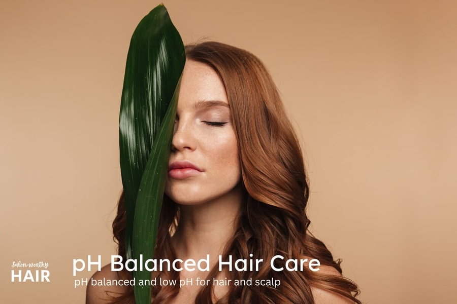 A clean, aesthetic visual pairing a model with a single green leaf to emphasize natural hair health and pH-balanced care.