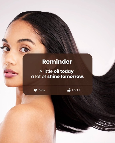 A high-contrast visual featuring a close-up of a model's hair overlaid with a mobile-style notification bubble that communicates the product benefit.