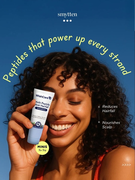 A high-quality 3:4 portrait ad featuring a close-up of a model smiling while holding a multi-peptide anti-hairfall shampoo.