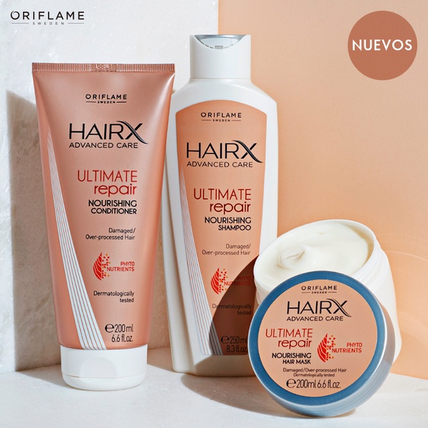 A high-quality product hero shot displaying a shampoo, conditioner, and hair mask against a clean, warm-toned studio background.