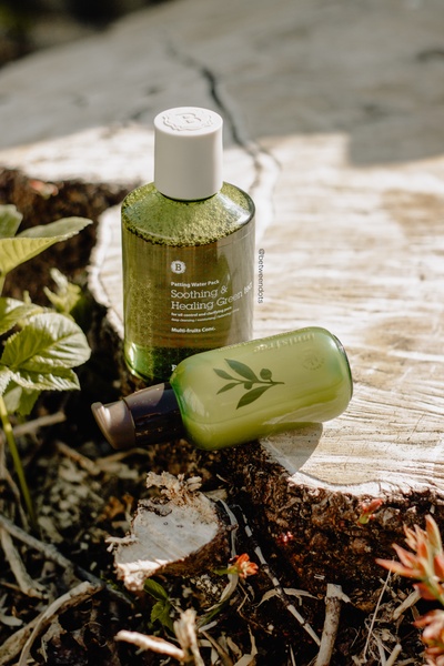 face serum, skin toner, skincare bottles, facial skincare, beauty products, lifestyle, outdoor, fresh, calm, green, brown, neutral