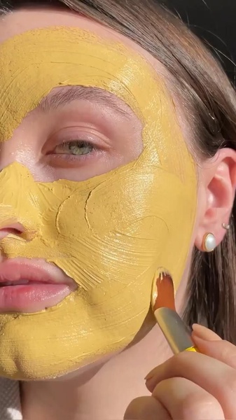 face mask, clay mask, skincare product, facial treatment, mud mask, product demo, lifestyle, calm, fresh, yellow, neutral