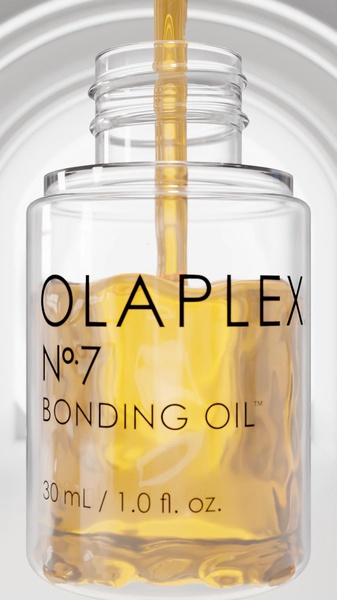 A close-up, high-definition 9:16 vertical shot of liquid bonding oil being poured into a transparent bottle, emphasizing the product texture and brand identity.