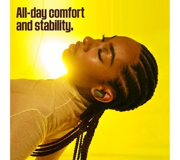 This static creative focuses on the physical comfort and secure fit of wireless earbuds using a vibrant, high-contrast yellow background.