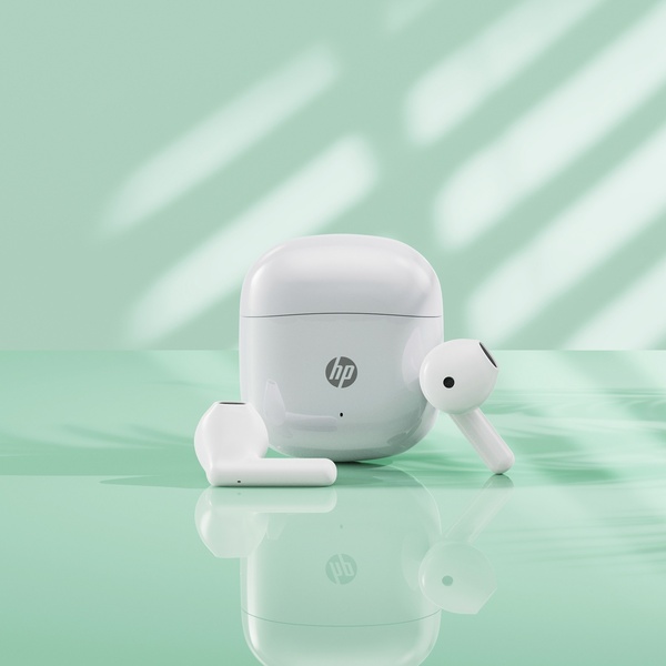 A clean, high-key studio product shot of wireless earbuds in a case, placed against a soft mint-green background with natural shadow patterns.