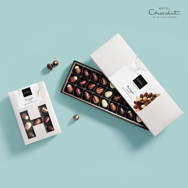chocolate eggs, chocolate box, gourmet chocolates, candy assortment, spring chocolates, new arrival, gift guide, minimalist, flat lay, fresh, calm, pastel, neutral, easter