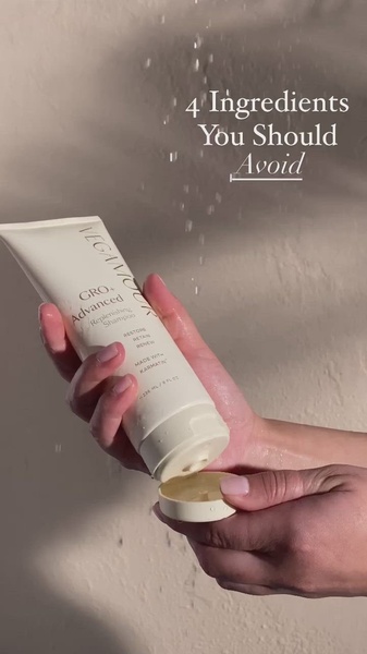 A close-up aesthetic shot of a shampoo bottle being held while water drips, paired with a curiosity-inducing headline about ingredients to avoid.