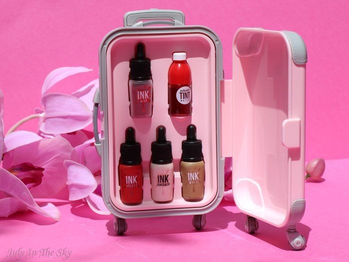 makeup gift set, lip tint set, cosmetic travel set, mini makeup collection, lip color set, beauty set, bundle offer, product launch, lifestyle, flat lay, playful, warm, pink, red, neutral