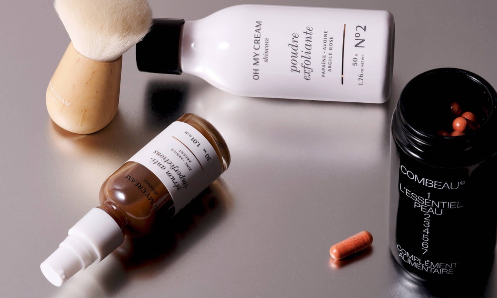 face serum, exfoliating powder, skin supplement, skincare products, beauty tools, bestseller push, minimalist, flat lay, calm, trustworthy, neutral